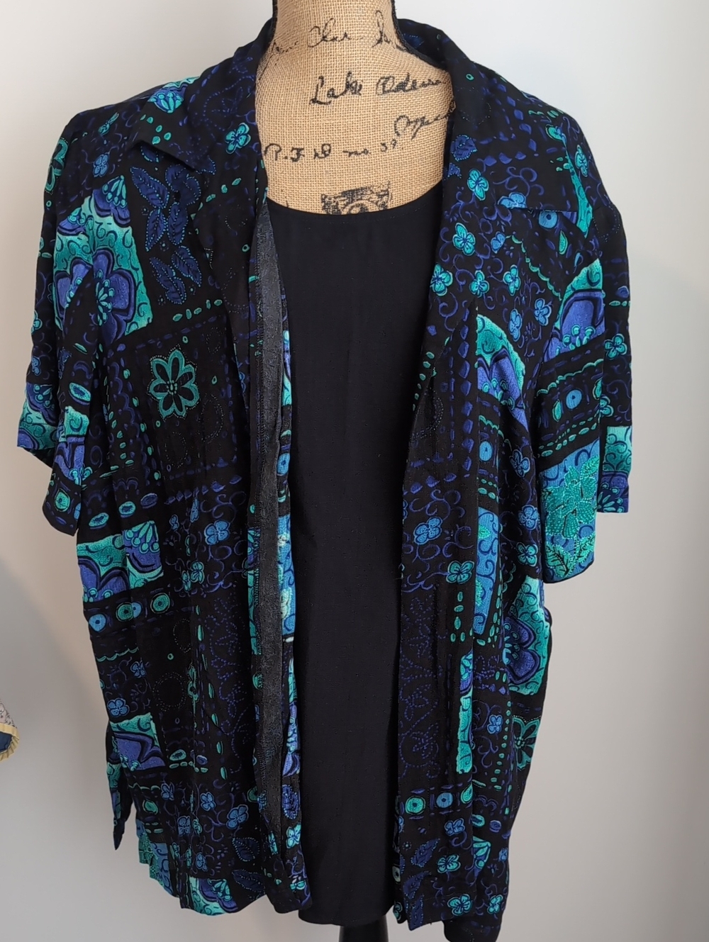 Fashion Bug Black Open-Front Sweater with Teal & Blue Floral Pattern